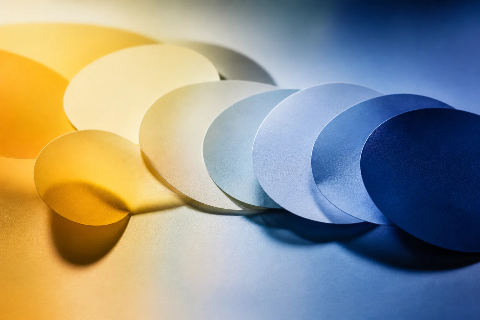 Overlapping warm and blue paper circles suggesting a daily rhythm